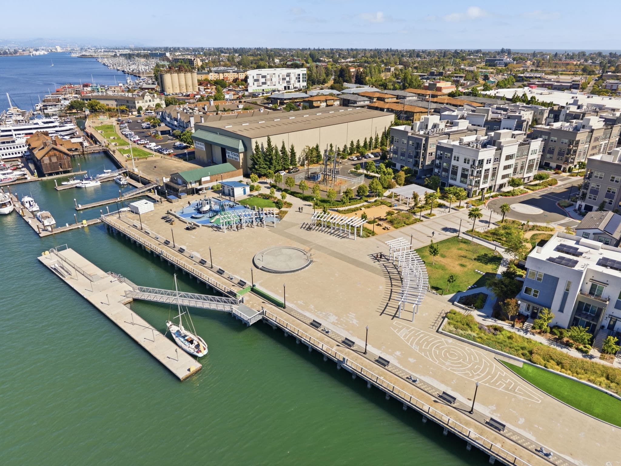 Waterfront park with playground and splash pad, steps from the home