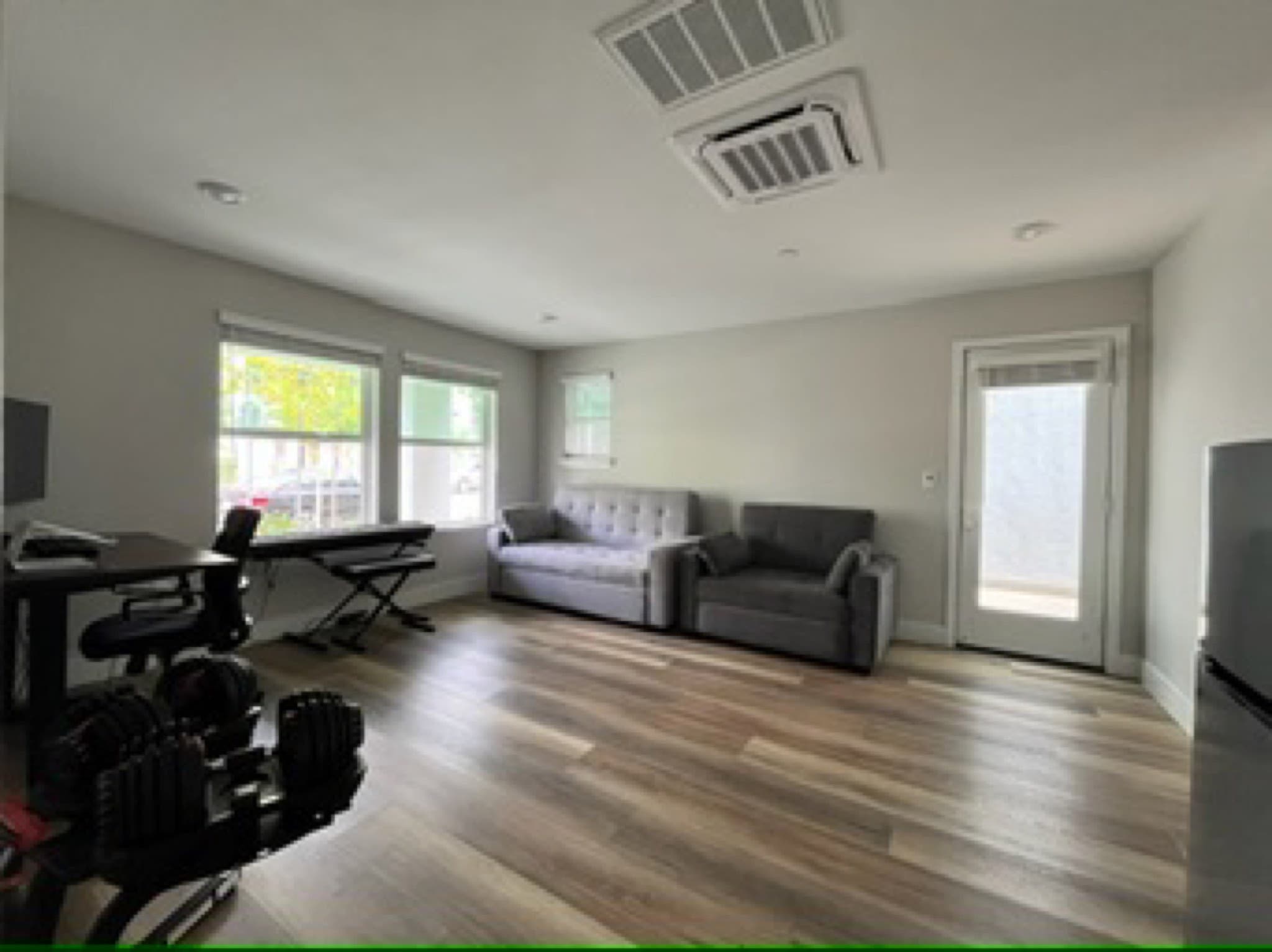 Open living and family room with luxury vinyl plank flooring