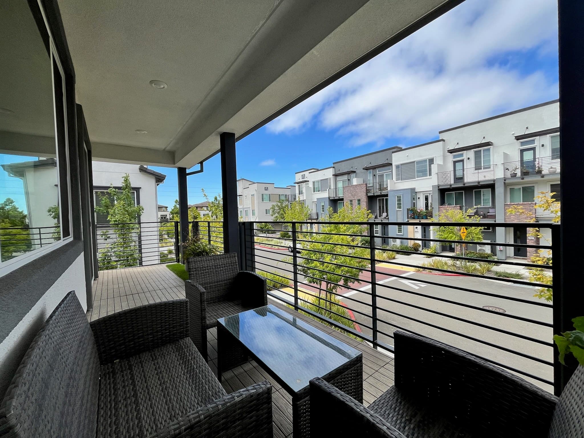 Covered second-floor balcony with neighborhood views